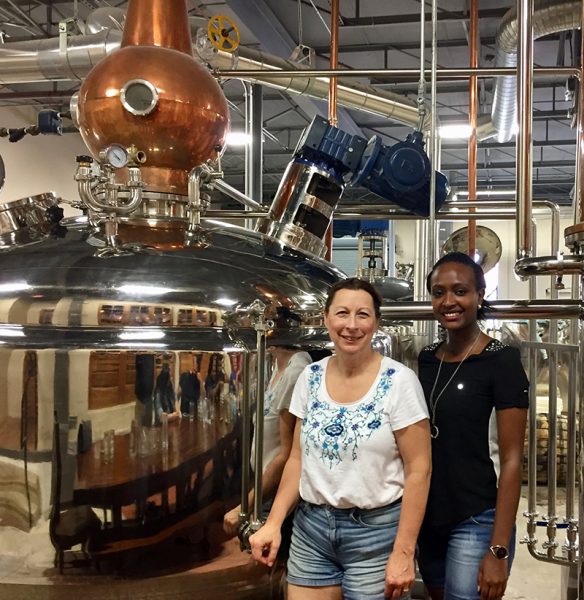 Melinda Lockhart, mentor, with Yvonne Umutoni, visiting a Dallas brewery
