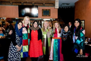 2015 JEWEL Fashion Show, July 14, 2015. Afghan PEACE THROUGH BUSINESS(r) delegation with OU Medical School models, including Cora Lee Toal wearing jackets made by Wonderland Women, Manizha Wafeq of Afghanistan.