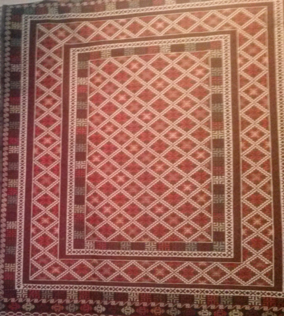 One of the many beautiful Afghan carpets offered in Nafisa's store.
