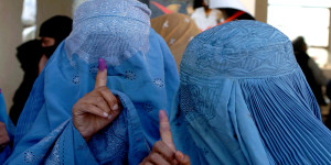 Two Afghan women proudly display the "mark" of voting in Kabul.